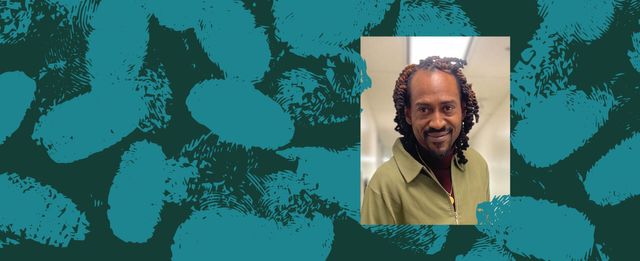 Portrait of a person smiling against a teal textured background.