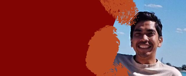 Portrait of a smiling person on a red and orange abstract background.