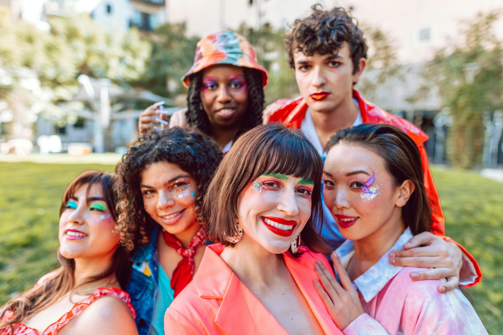 Group of friends smiling in city park